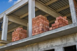 depositphotos_62164751-stock-photo-stacked-red-hollow-clay-blocks