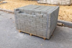 new-paving-slabs-packed-stack-wooden-pallet-before-laying-building-materials-construction-site_156745-782 (1)